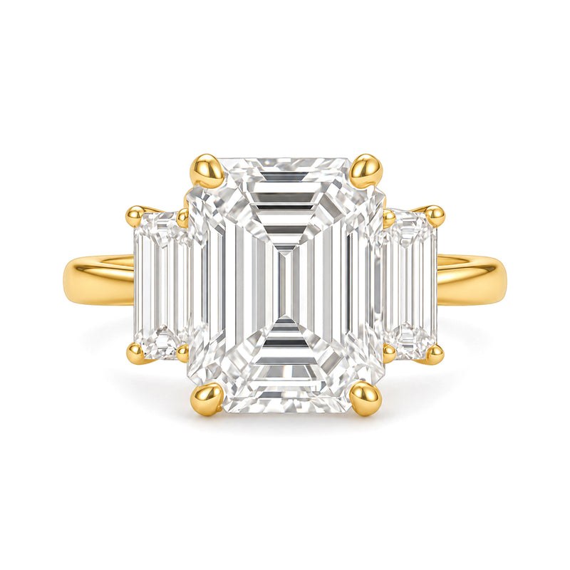 Ella Ring yellow gold emerald-cut three-stone diamond ring on a white background